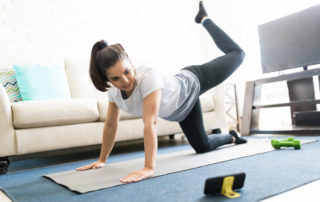 woman exercising in a digital musculoskeletal program