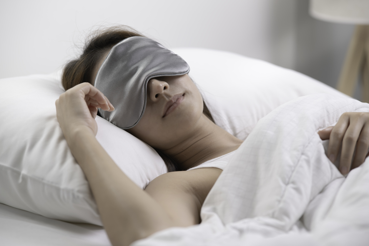 woman sleeping peacefully with an eye mask